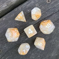 Image 1 of GOLD DUST POLYHEDRAL DICE SET semi-opaque white and gold base