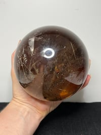 Image 21 of Golden Rutile In Smoky Quartz Sphere #1770