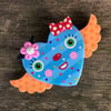 Orange Winged Blue Striped Heart Face with Bow and Flower Clay Wall Hanging