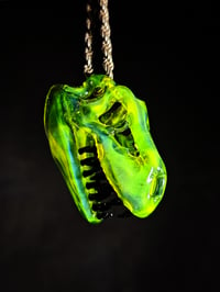 Image 1 of Yellow opal layered with blue stardust T-Rex pendant. 