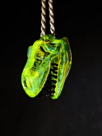 Image 2 of Yellow opal layered with blue stardust T-Rex pendant. 