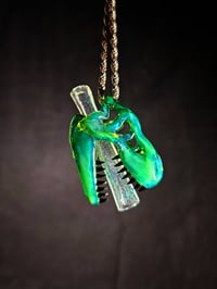 Image 2 of Titan V4 T-Rex skull pendant with galaxy teeth & a green dichro joint tip. 