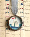 sail no. 35 in brass porthole locket