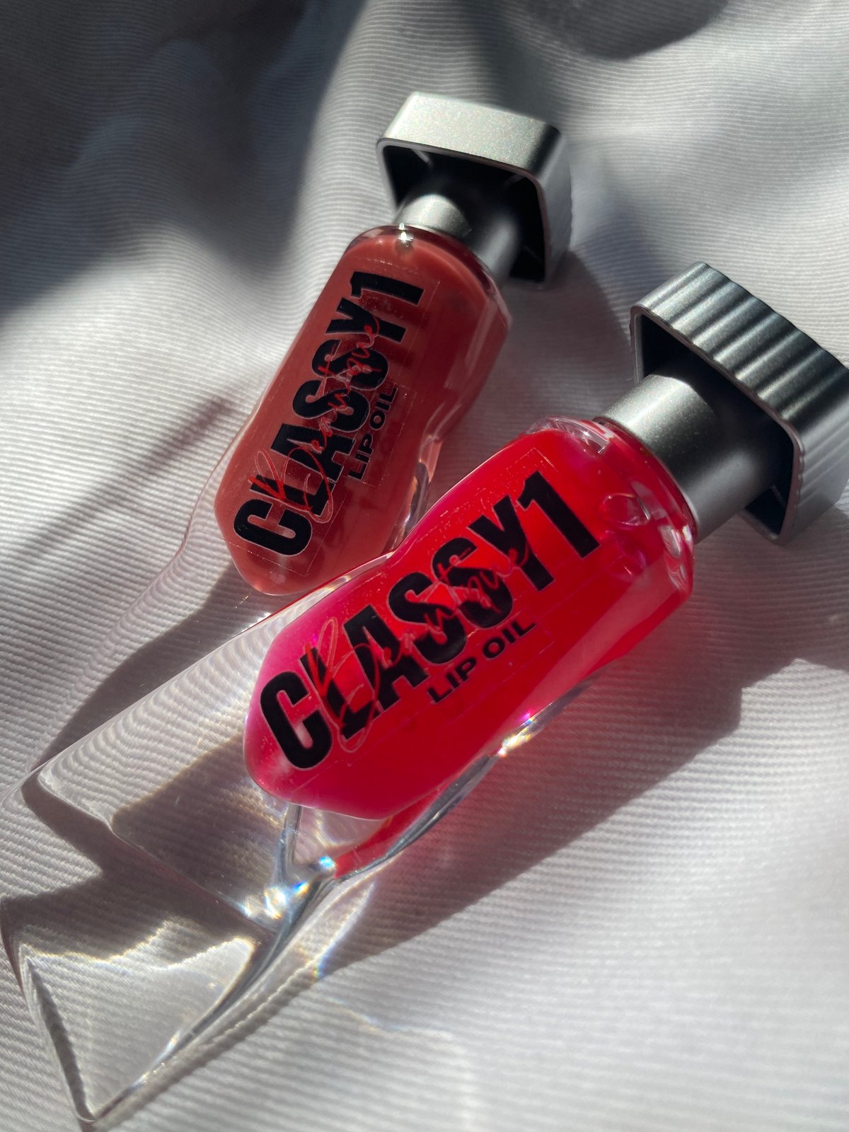 Classy1Beautique Lip Oil in shades Tickled, and Red Ruby.