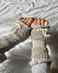 Image 1 of striped handwarmers in grey