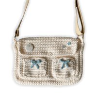 Image 1 of cream & baby blue bow messenger bag