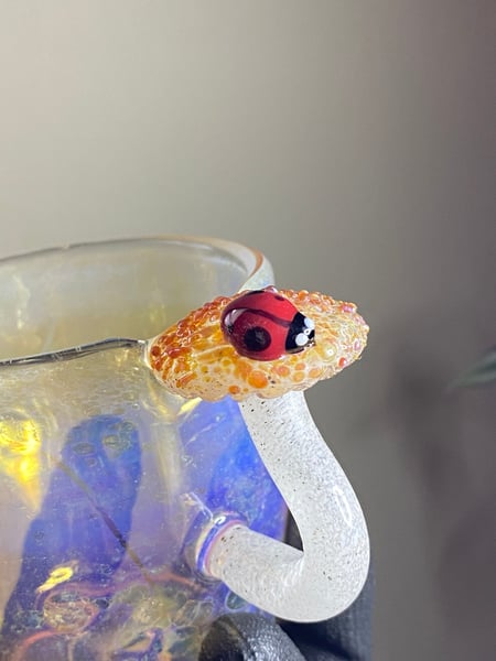 Image of Teacup with mushroom handle and ladybug