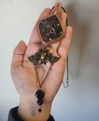 Image 4 of Turritella Agate Bat Pendant 