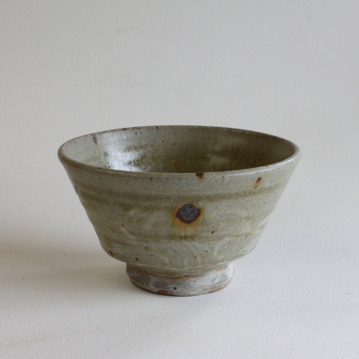 Image of brushed Slip and Ash glazed Footed Bowl