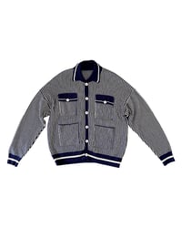 Casaco de malha às riscas azul