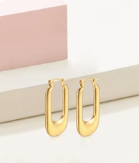 Image 1 of Ribbed Hoop Earrings.