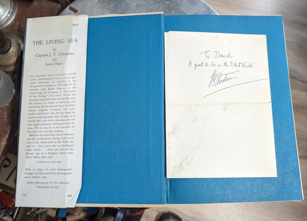 Jacque Cousteau autograph and book "The Living Sea"