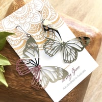 Image 1 of High Shine Silver Steel Butterfly Dangle Earrings