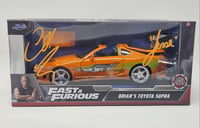 "Fast and Furious" Brian's Orange Supra scale 1/32 -- AUTOGRAPHED.