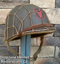 Image 1 of WWII M1 Helmet 34th Infantry Division Schlueter Fixed bale & replica rayon Hawley Liner. NCO.