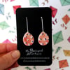 Ceramic earrings -hand painted peach with white/blue spots