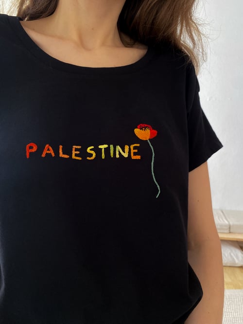 Image of Palestine - Original hand embroidery on a black t-shirt, made of organic cotton