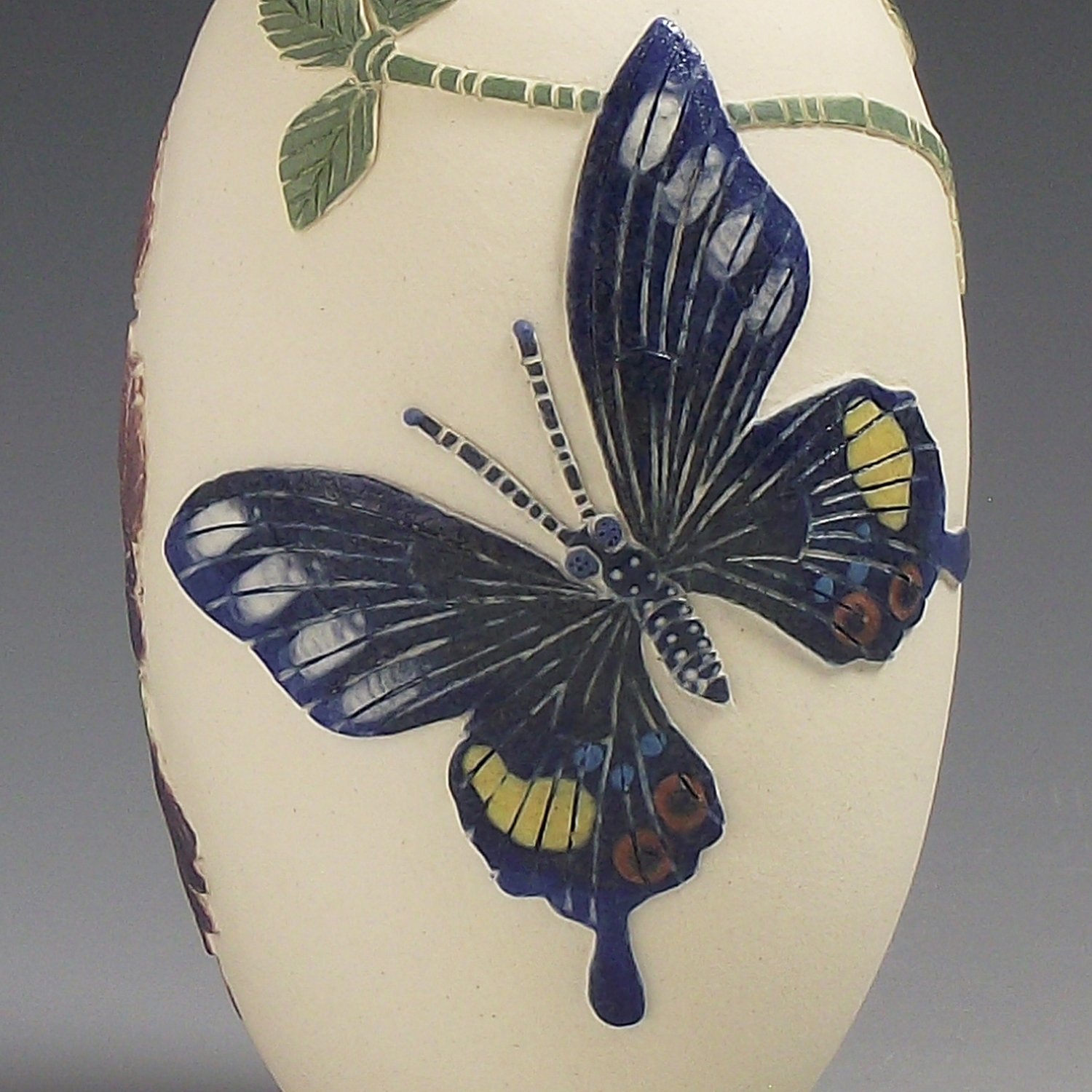 Image of Iswara butterfly & velvet bean plant open form sgraffito vessel