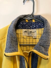 Image of Dandelion coat with hand quilted blue and gray details 