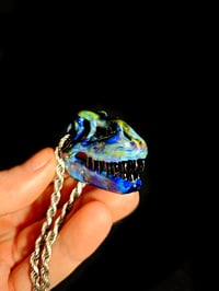 Image 1 of Blue amber purple T-Rex skull pendant with galaxy teeth