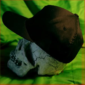 Image of TCG embroidered BLACK logo on baseball cap