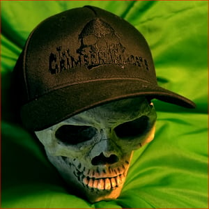 Image of TCG embroidered BLACK logo on baseball cap