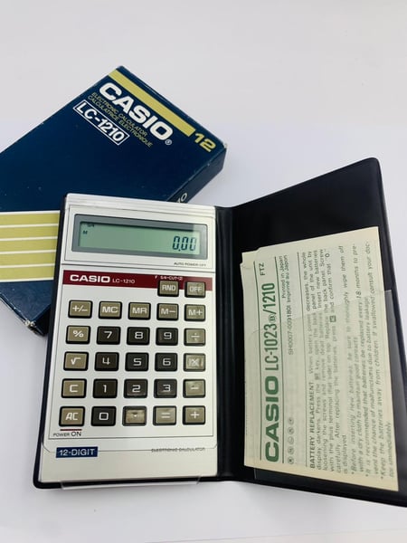 Image of New Old Stock,Vintage Casio LC-1210,LC1210,12 digits display, LCD,Calculator-box and papers.1970's