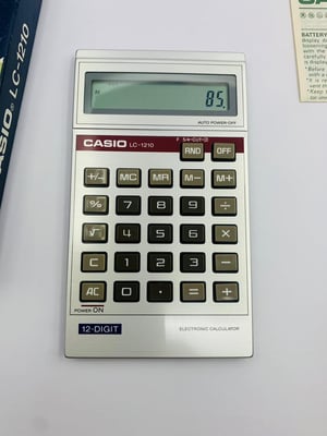 Image of New Old Stock,Vintage Casio LC-1210,LC1210,12 digits display, LCD,Calculator-box and papers.1970's