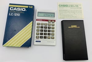 Image of New Old Stock,Vintage Casio LC-1210,LC1210,12 digits display, LCD,Calculator-box and papers.1970's