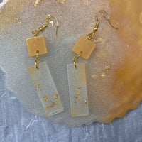 Image 2 of earrings with golden/silver flakes