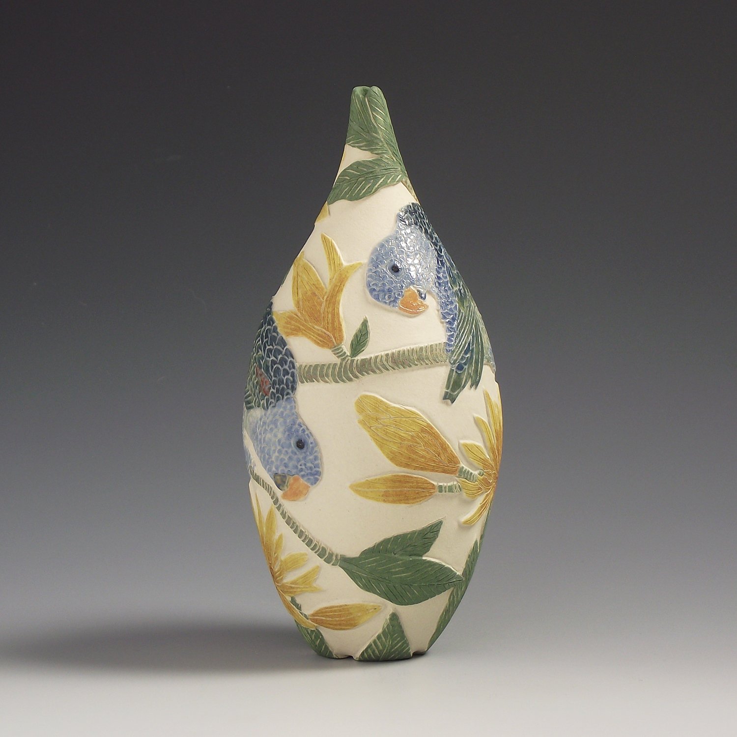 Image of Blue Rumped Parrots & magnolia