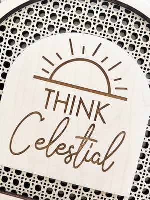 Image of “Think Celestial” faux rattan shelf sign