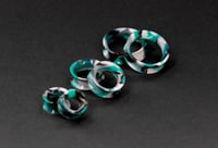 Image 1 of Black, Green and White Marbled Silicone Tunnels - Stretched Ears - 4-25MM