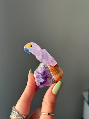 HAND CARVED SELF STANDING BIRDS ON AMETHYST BASES