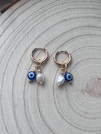 Image 3 of 18k gold Evil Eye Pearl Huggies