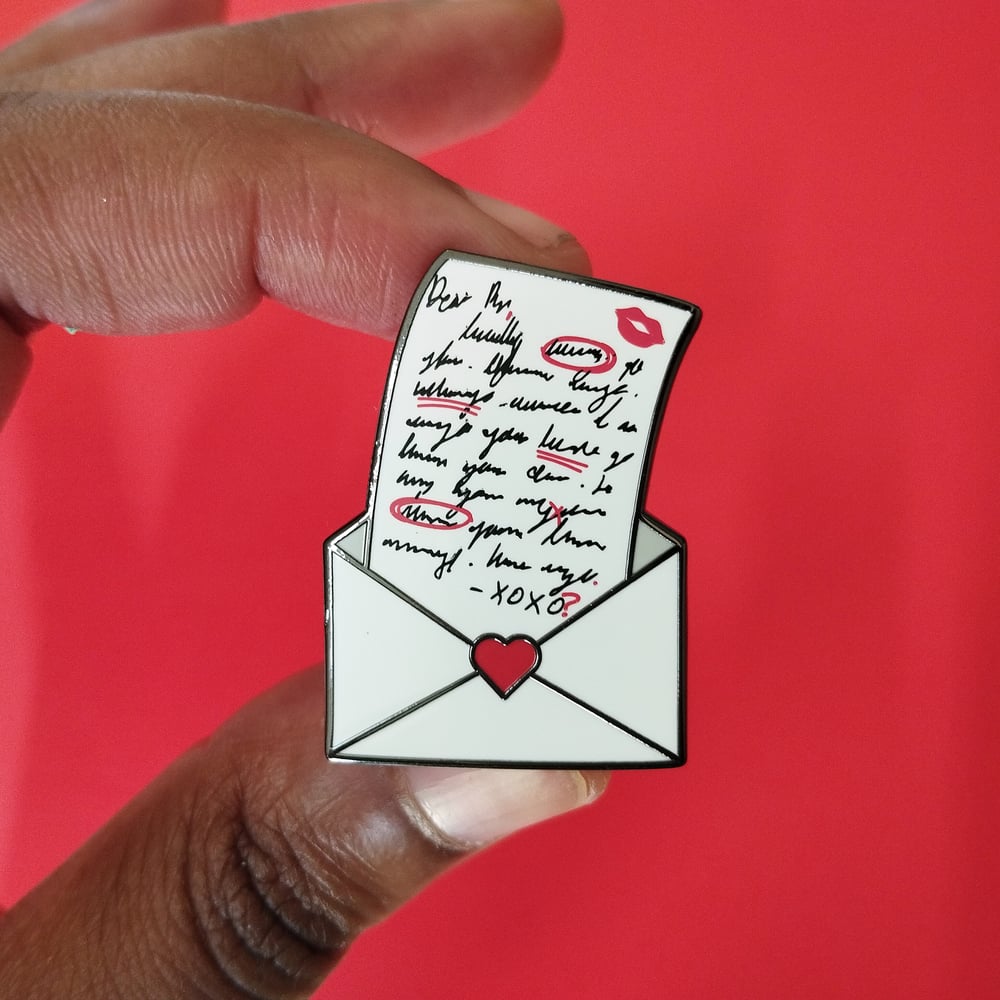 Image of return to sender enamel pin