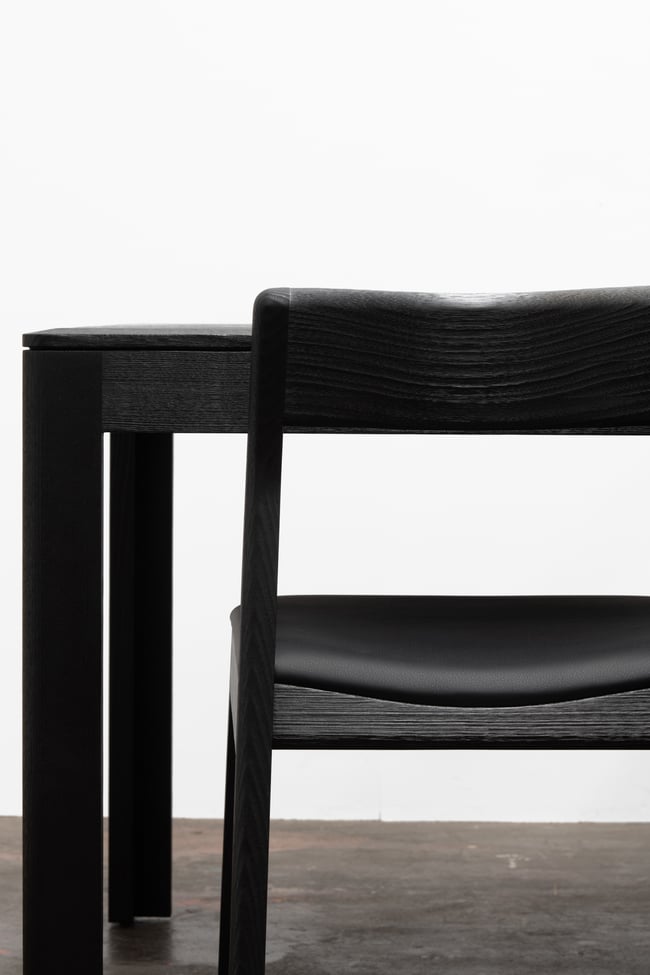 ROSE DINING CHAIR IN TORCHED TASMANIAN OAK WITH AN UPHOLSTERED LEATHER SEAT