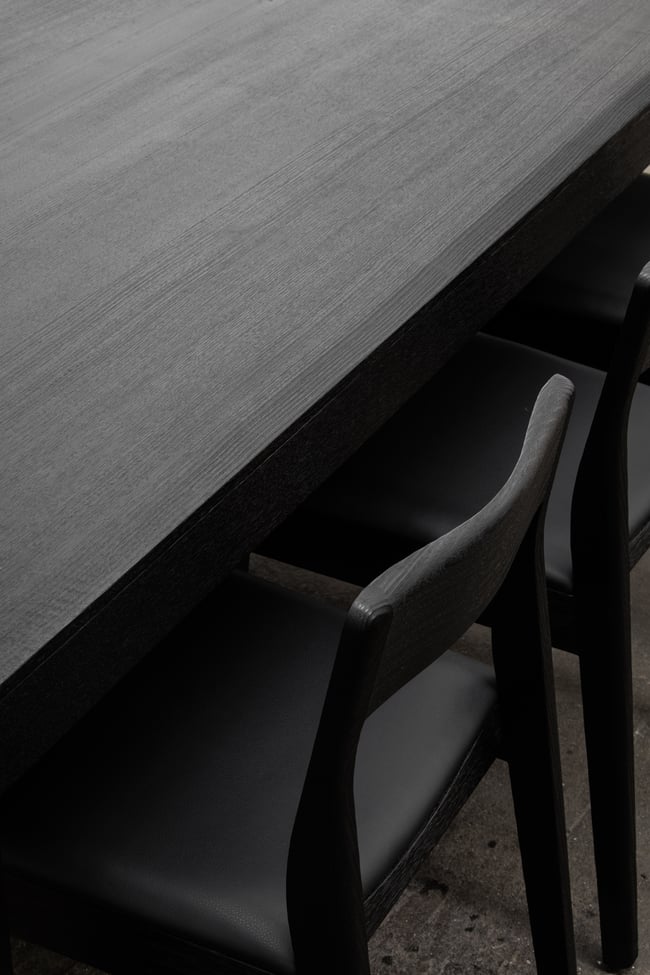 ROSE DINING CHAIR IN TORCHED TASMANIAN OAK WITH AN UPHOLSTERED LEATHER SEAT