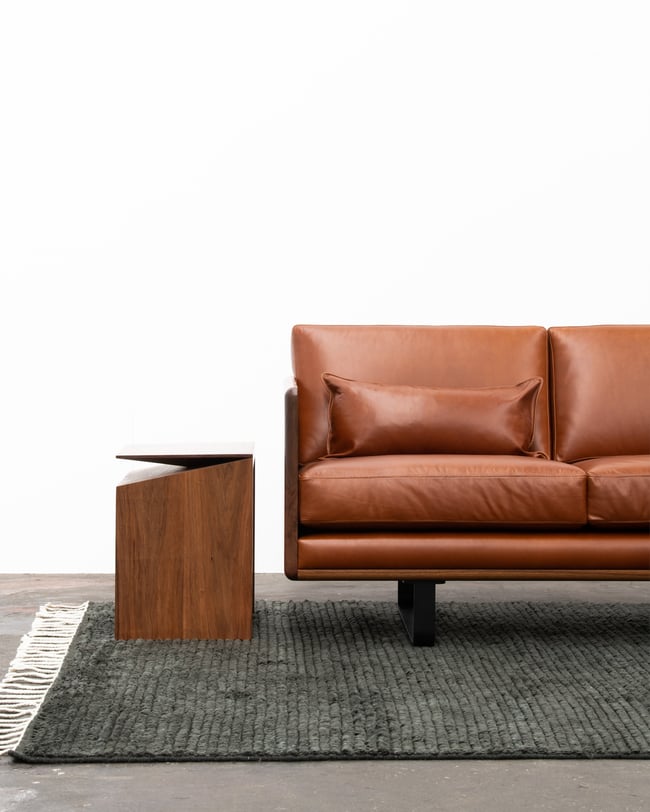 CLOVER COUCH IN TASMANIAN BLACKWOOD WITH SUNDANCE LEATHER