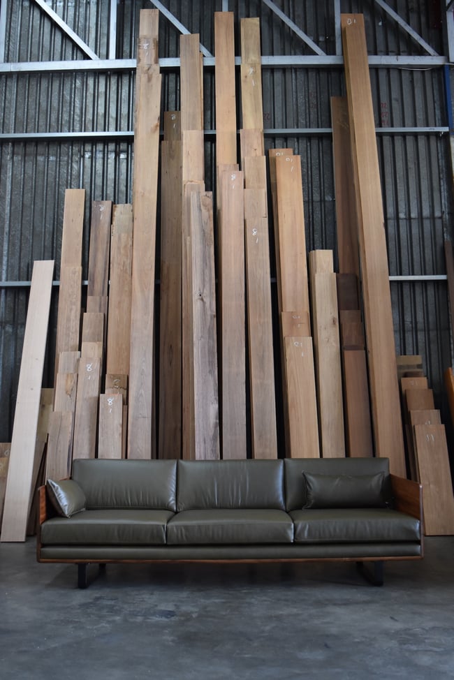 CLOVER COUCH IN TASMANIAN BLACKWOOD WITH SUNDANCE LEATHER