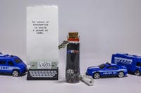 Image 1 of Police Services - Message in a Bottle