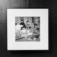 Image 5 of A customer browses Horigorō II designs available. C.1955, Tokyo - Gelatin silver print