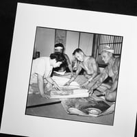 Image 1 of A customer browses Horigorō II designs available. C.1955, Tokyo - Gelatin silver print