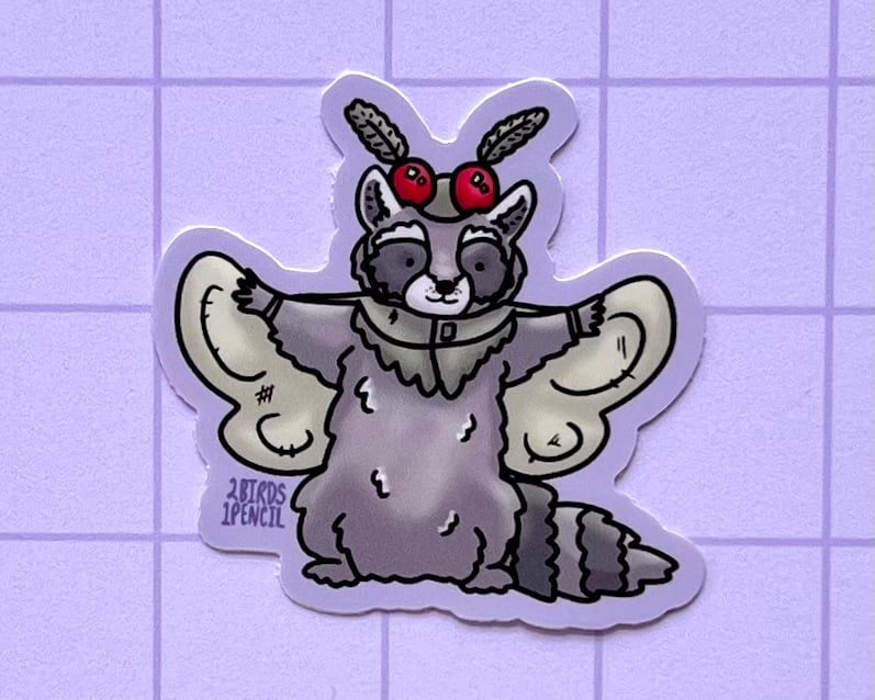 Image of Mothman raccoon mini vinyl sticker