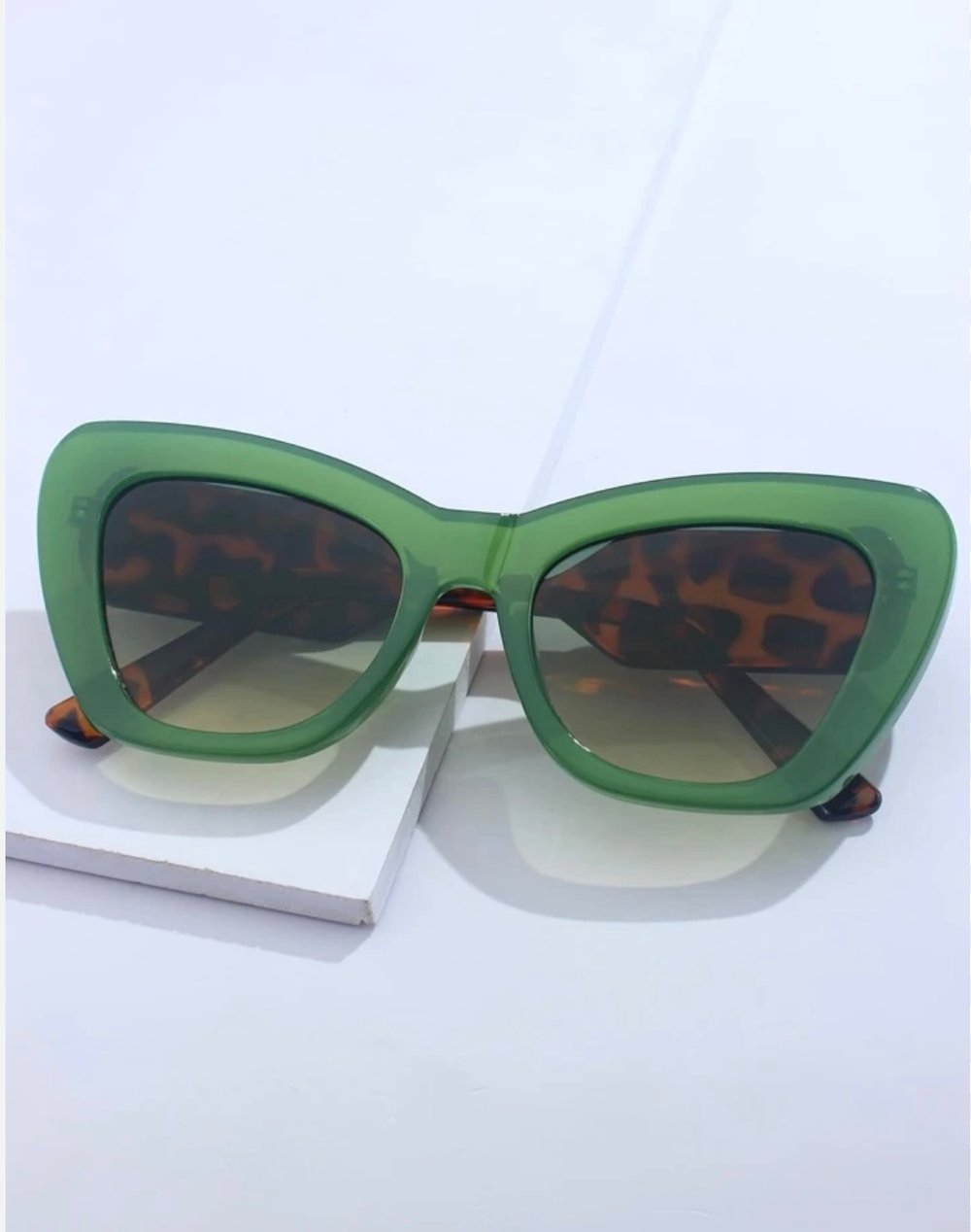 Image of Tort shell sunglasses with green frame