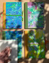 Image 3 of Bright yellow, Pale Orange and Fresh Green Hand-Marbled Thick Lined A5 Notebook- Daffodil Pattern