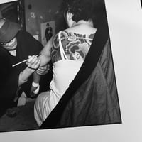 Image 3 of Horiuno II drawing the future tattoo motif with a brush 