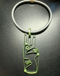 Image 3 of lime green face pendant