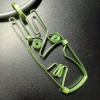 Image 1 of lime green face pendant