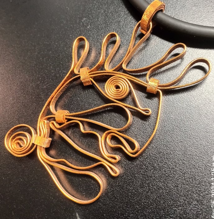 Image of face pendant #2